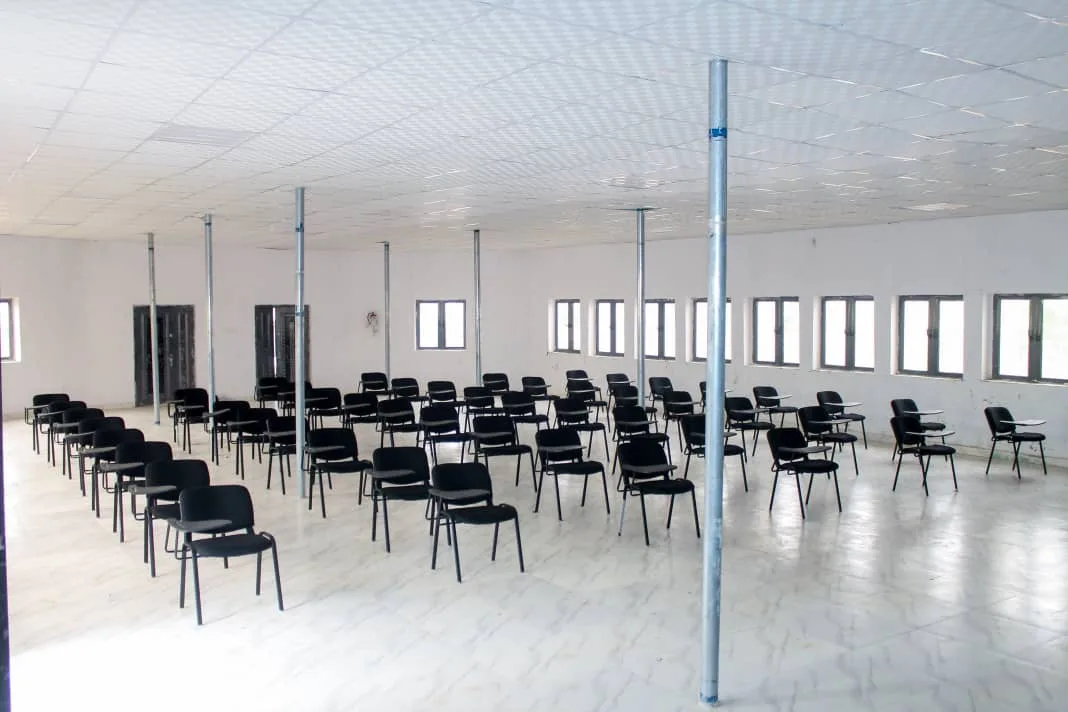 Interior of the Hector University lecture theatre with rows of upgraded individual writing chairs